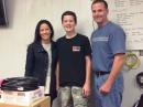 Bryant Rascoll, KG5HVO, is flanked by his mom, Lauren, and his dad, Tim, following his award presentation.